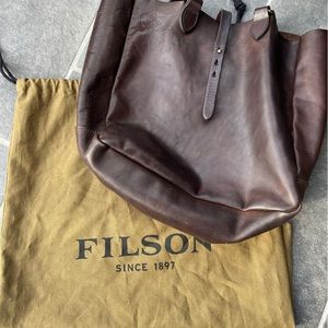 Filson weatherproof tote in gorgeous, dark brown leather.